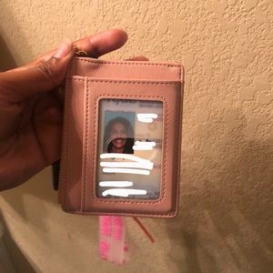 Thin light pink ID wallet